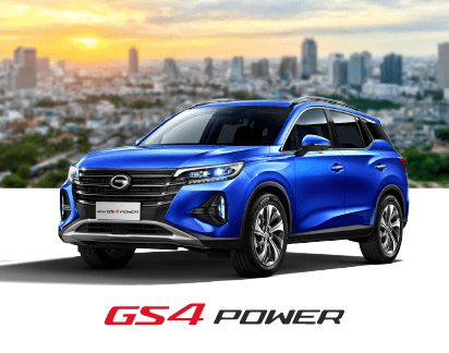 Crossover azul GS4 Power en ciudad con atardecer de fondo.