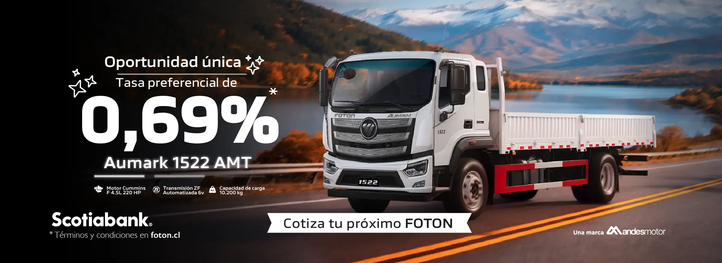 Camión Foton en carretera con paisaje de montañas y lago.