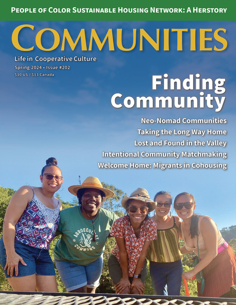 Group of diverse people smiling outdoors in a community setting.