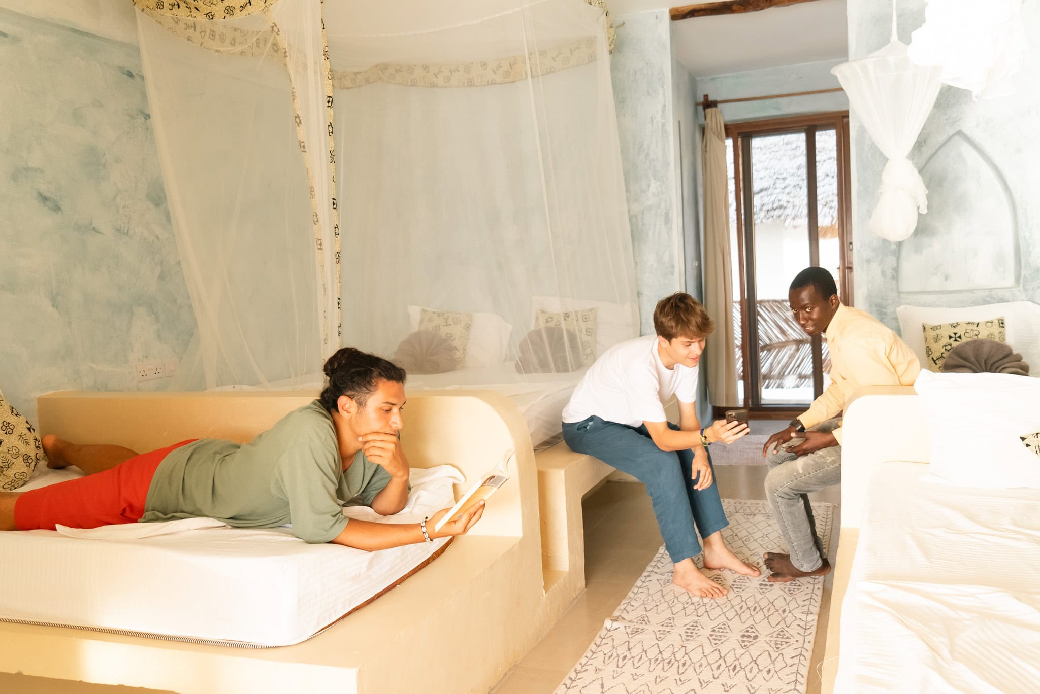 People in a bright eco-friendly living area having a discussion.