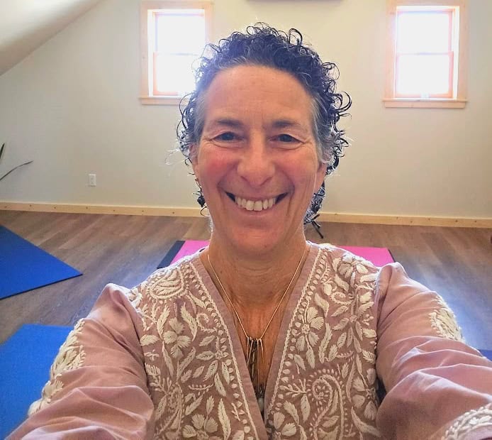 Global Ecovillage Network banner in peaceful wellness studio urban retreat.