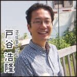 Portrait of Hirotaka Toya outdoors with logo text.