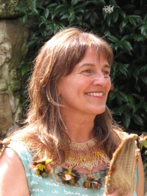 Irene Goikolea at an eco village event, smiling outdoors.