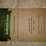 Global Ecovillage Network concept poster in German.