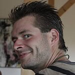 Smiling man in a casual setting.