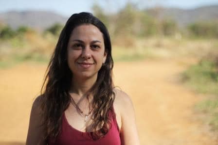 Portrait of a woman in a natural outdoor setting on a sunny day.