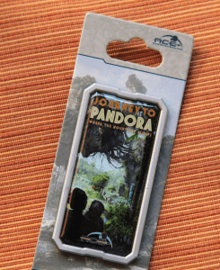 “Journey to Pandora” collectible pin featuring Avatar’s Pandora – The World of Avatar, displayed on an orange park-themed surface.