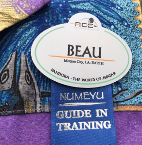 BEAU name badge from Pandora at Walt Disney World with "GUIDE IN TRAINING" ribbon and vibrant, Avatar-inspired colors.