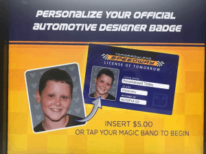 Tomorrowland Speedway badge kiosk at Disney World offers $5 custom IDs with your photo—feel like a real Tomorrowland racer!.