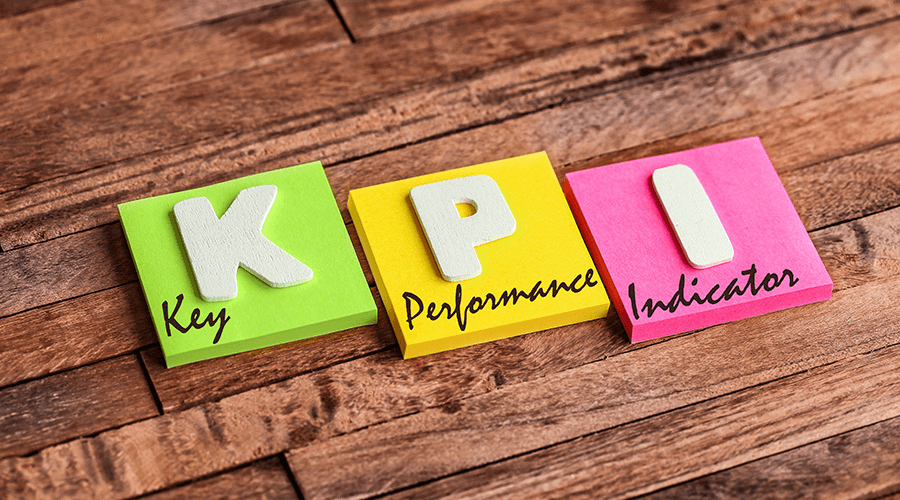 Three sticky notes in different colors spelling out "KPI," with "Key Performance Indicator" written underneath, representing key performance indicators (KPIs) analysis and business growth consulting.