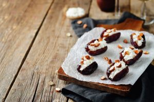 Almond and goat cheese stuffed dates. toning. selective focus