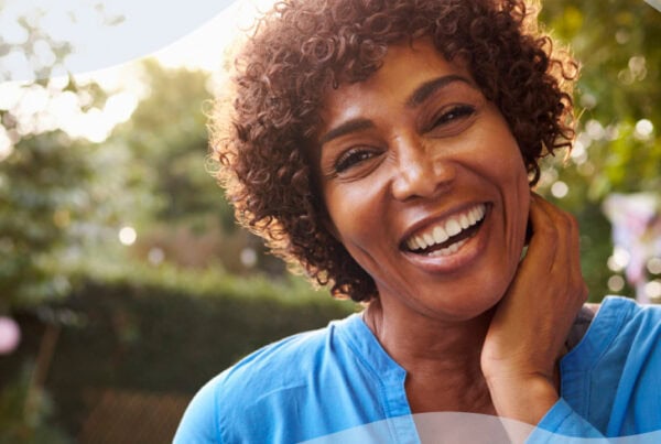Smiling woman representing the benefits of personalized hormone therapy through compounded BHRT