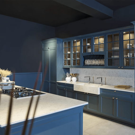 Silestone Lyra white countertops paired with stylish blue cabinets, creating a modern and inviting space