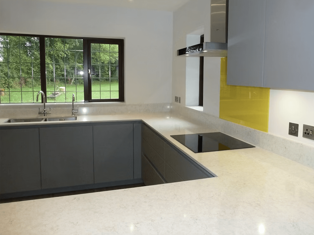 Sleek Silestone Lusso sample in a contemporary white kitchen, emphasizing its seamless integration and subtle veining.