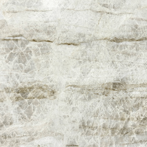 A close-up view of a Taj Mahal Premium Leathered Quartzite countertop slab featuring a creamy white background with elegant gold and brown veining and a textured matte finish.
