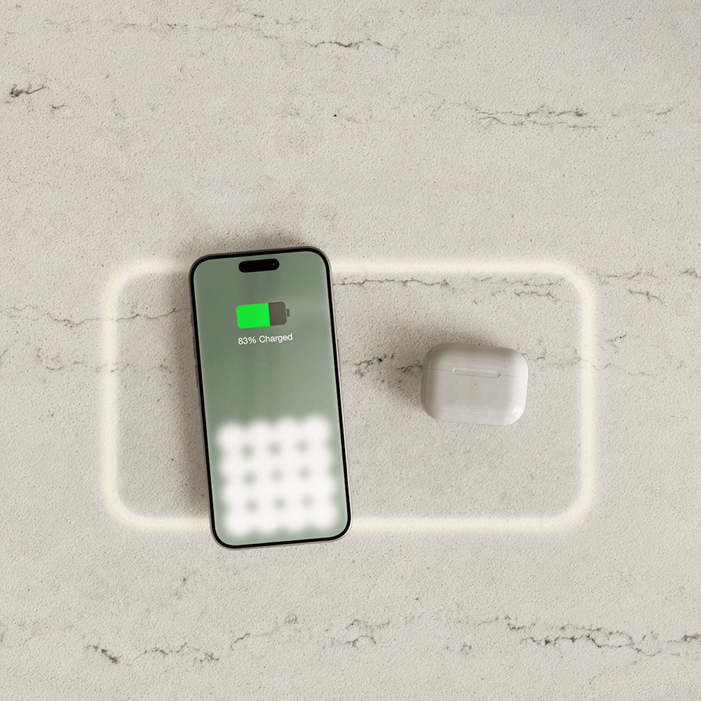 Integrated wireless charging countertop technology installed in a modern kitchen, offering seamless mobile device charging on stone surfaces by Arlington Marble, Fort Worth.