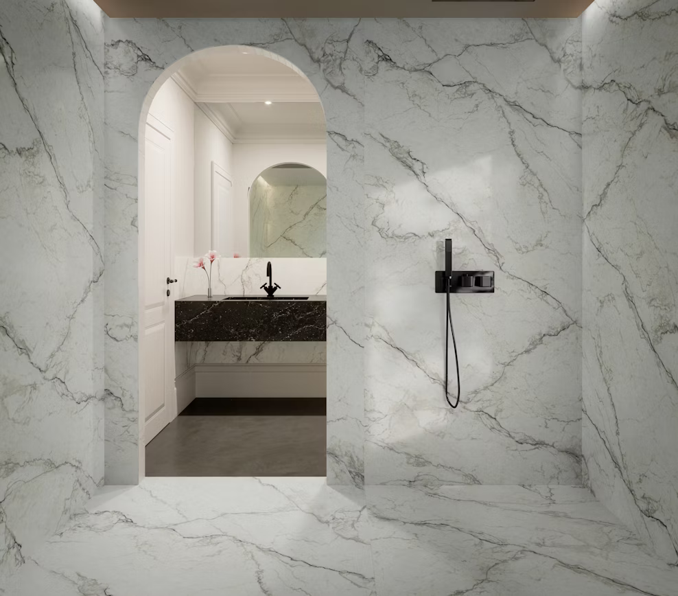 Luxury bathroom remodel featuring custom stone wall panels and a floating vanity in Cosentino Eclos Wondr by Arlington Marble.