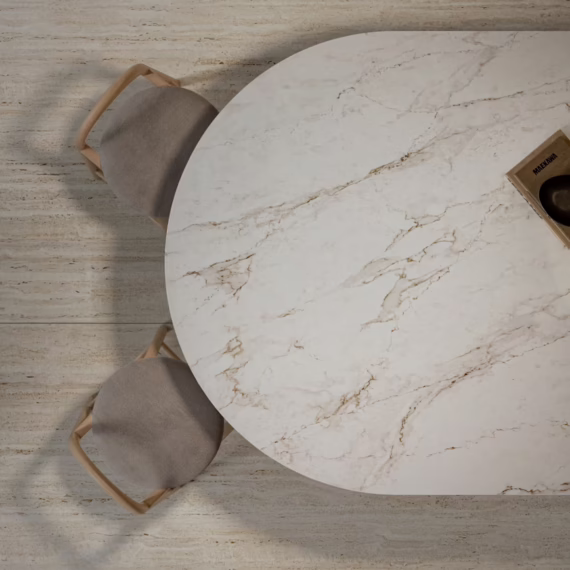 Overhead view of a luxury cream marble-look mineral surface breakfast bar with contemporary seating.