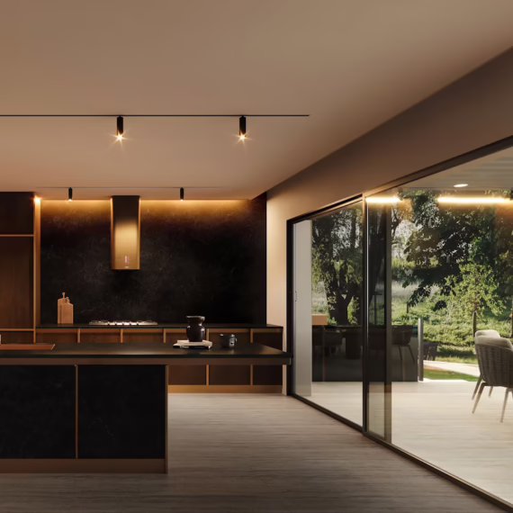 Modern black mineral surface countertops and full-height stone feature wall custom fabricated by Arlington Marble.