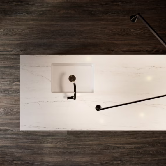 Birds-eye view of a bright white Ivora mineral surface countertop contrasting with dark hardwood floors.