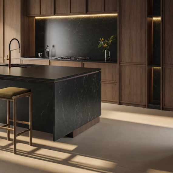 Custom dark matte stone countertop installation with full-height slab backsplash in a Fort Worth home.