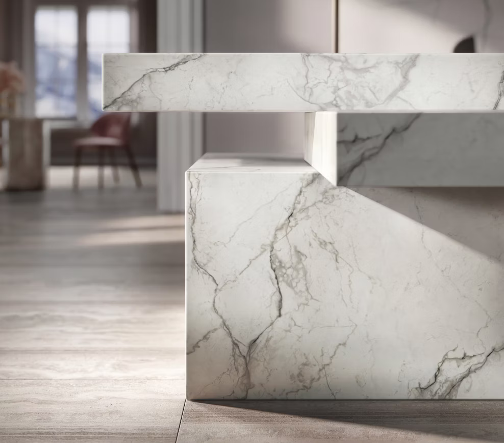 Custom mitered edge fabrication on a tiered kitchen island using Cosentino Eclos Wondr by Arlington Marble.