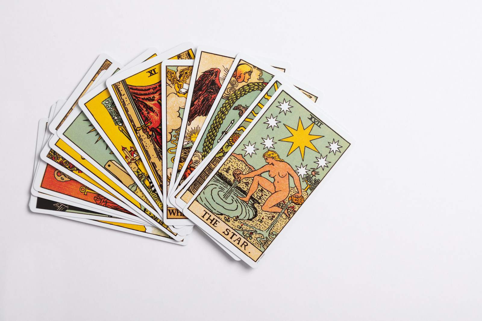 Astrological Houses, a deck of tarot cards on a white surface