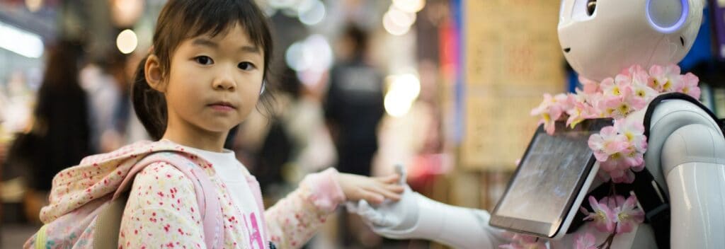 photo of girl laying left hand on white digital robot
