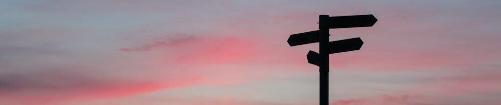 silhouette of road signage during golden hour