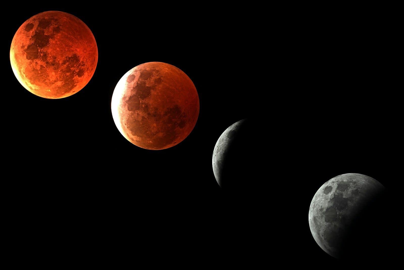 Phases of a lunar eclipse against a black sky