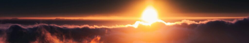 sun setting over the clouds