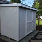 Garden storage shed for outdoor organization and tool storage.