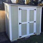 Garden shed with double doors, ideal for outdoor storage and organization.