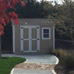 Garden shed with double doors and small window, ideal for outdoor storage solutions.