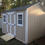 Durable beige garden shed with double doors and windows for outdoor storage.