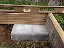Outdoor wooden shed with concrete base for durable storage solutions.