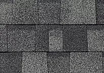 Close-up of dark gray asphalt roof shingles on Atlas Shed building.