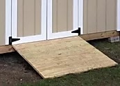 Wooden ramp leading to Atlas Shed for accessible entry and outdoor storage.