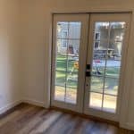Sliding glass door for backyard access and natural light.