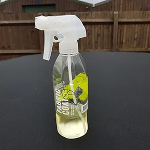 Fabric coat spray bottle on table outdoors.