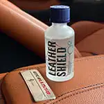 Leather shield bottle on car seat