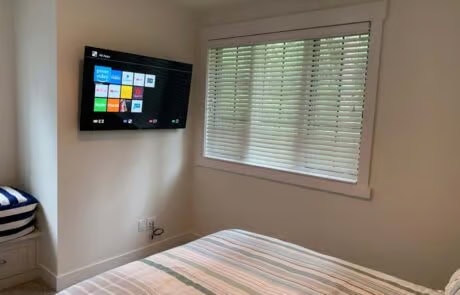 Close-up of bedroom smart TV wall-mounted AV installation at Suncadia home