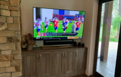 Close-up of wall-mounted TV and AV installation in Suncadia living room