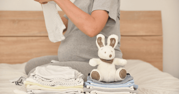 Soft baby clothes and plush toys for infants, perfect for new parents.