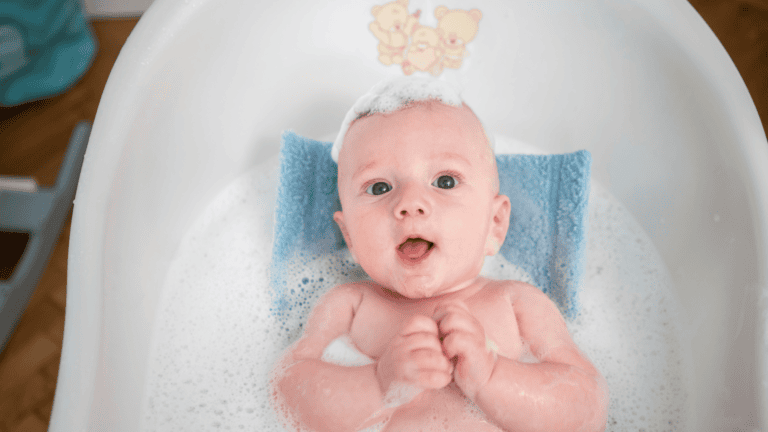 Soft baby bath with toys, baby in bubbles, gentle bath time, infant care, newborn bathing essentials.