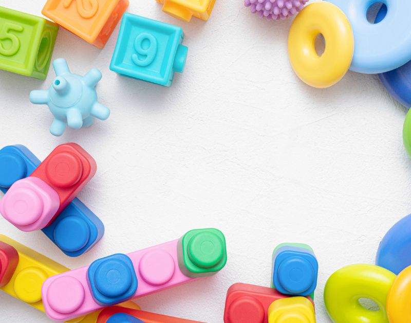 Colorful baby toys and clothes for infants and toddlers, ideal for baby shower gifts and nursery decor.