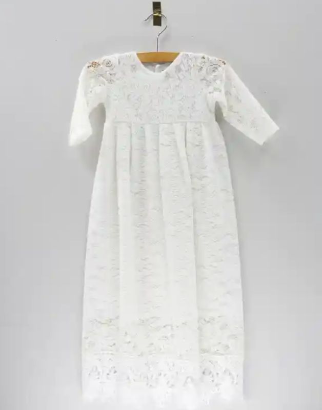Delicate white baby lace dress with floral embroidery, perfect for special occasions.