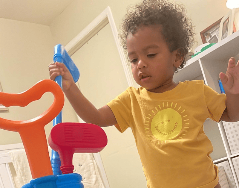 Colorful baby toy set for infant play and development.