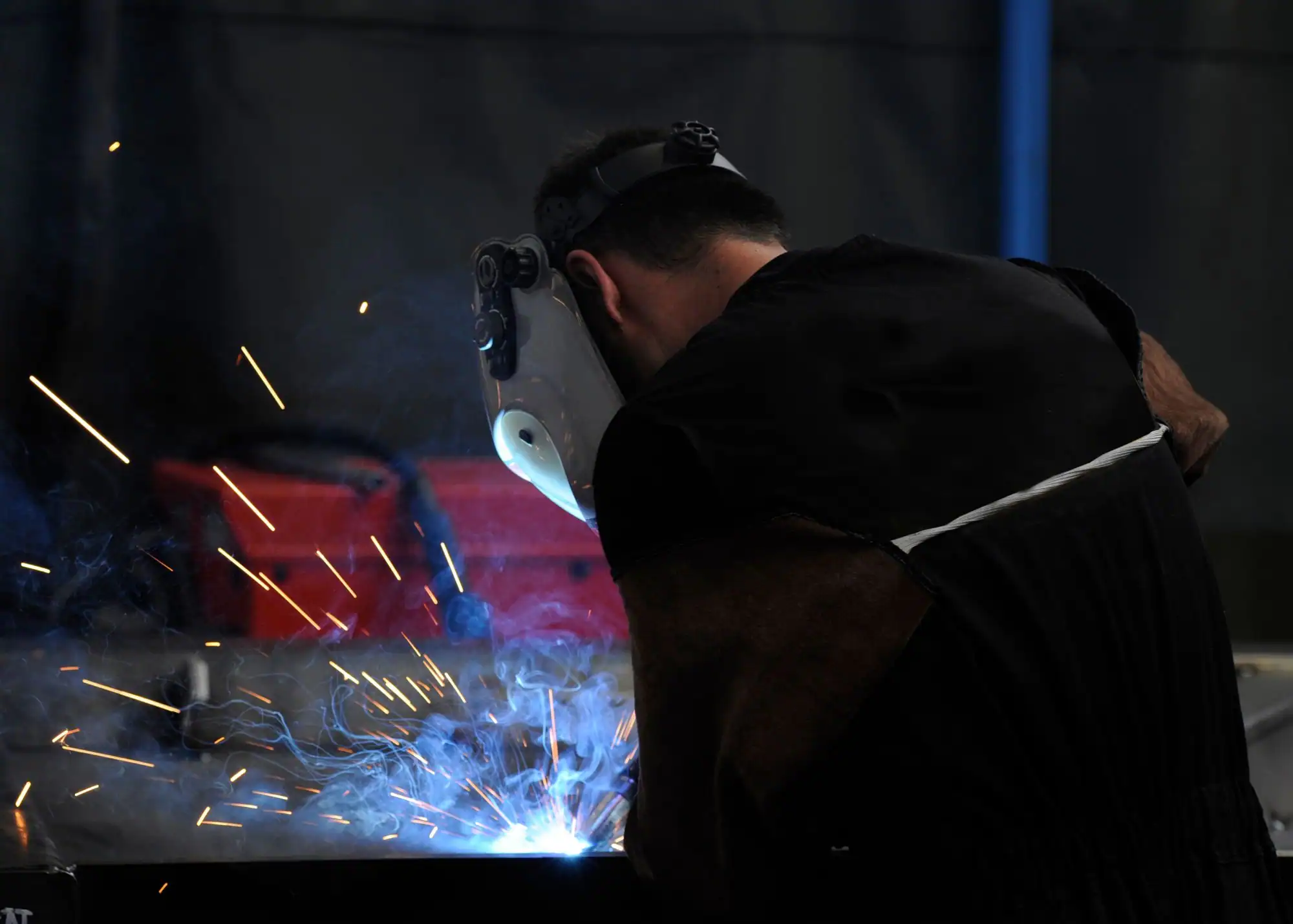 Welding technician performing metal fabrication at B&B Powder.