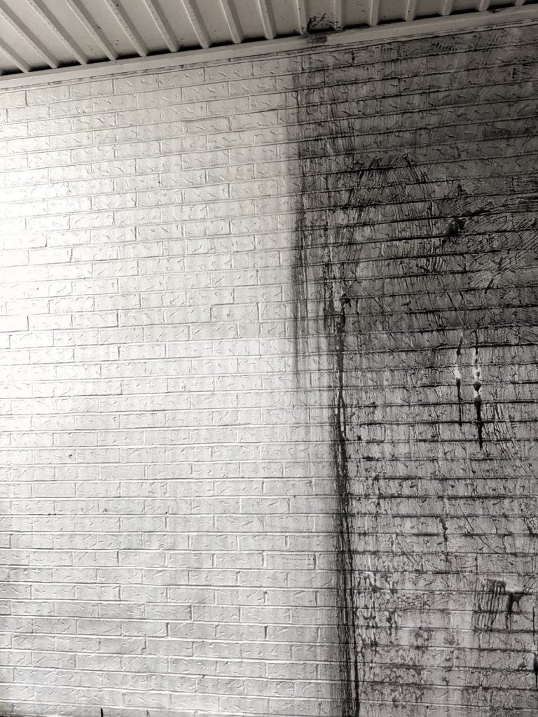 pressure washing a white wall in Baton Rouge LA